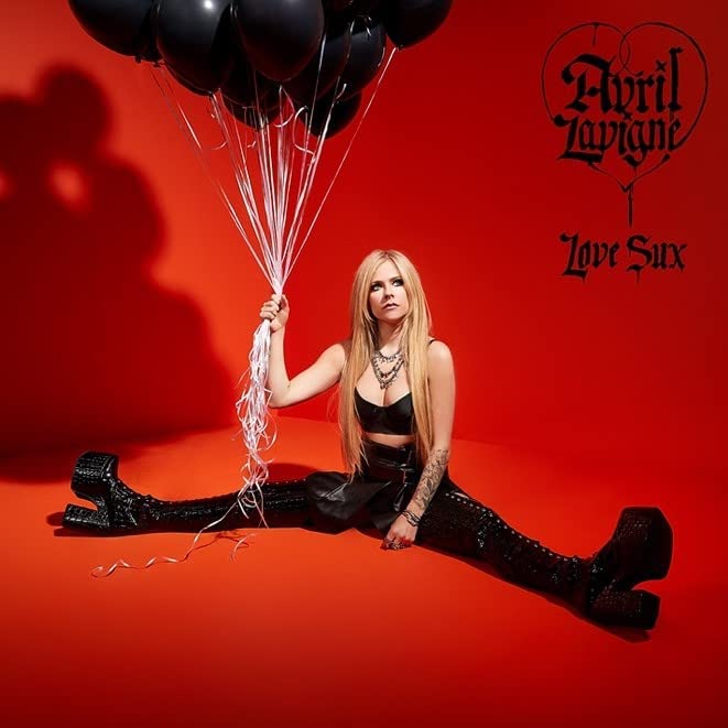 "Album cover featuring Avril Lavigne sitting with black balloons against a red background."