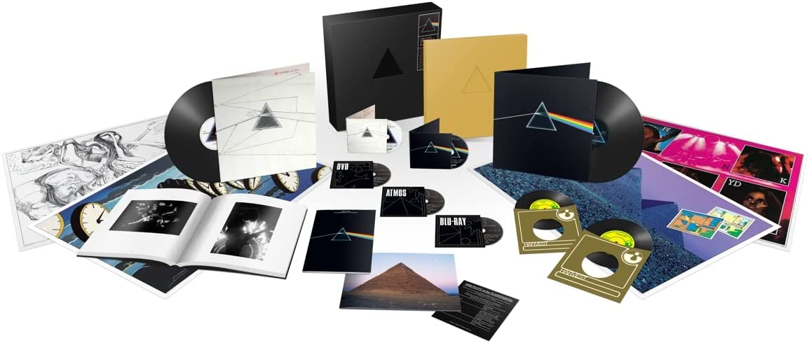 "Pink Floyd's Dark Side of the Moon 50th Anniversary Box Set contents displayed on white background."