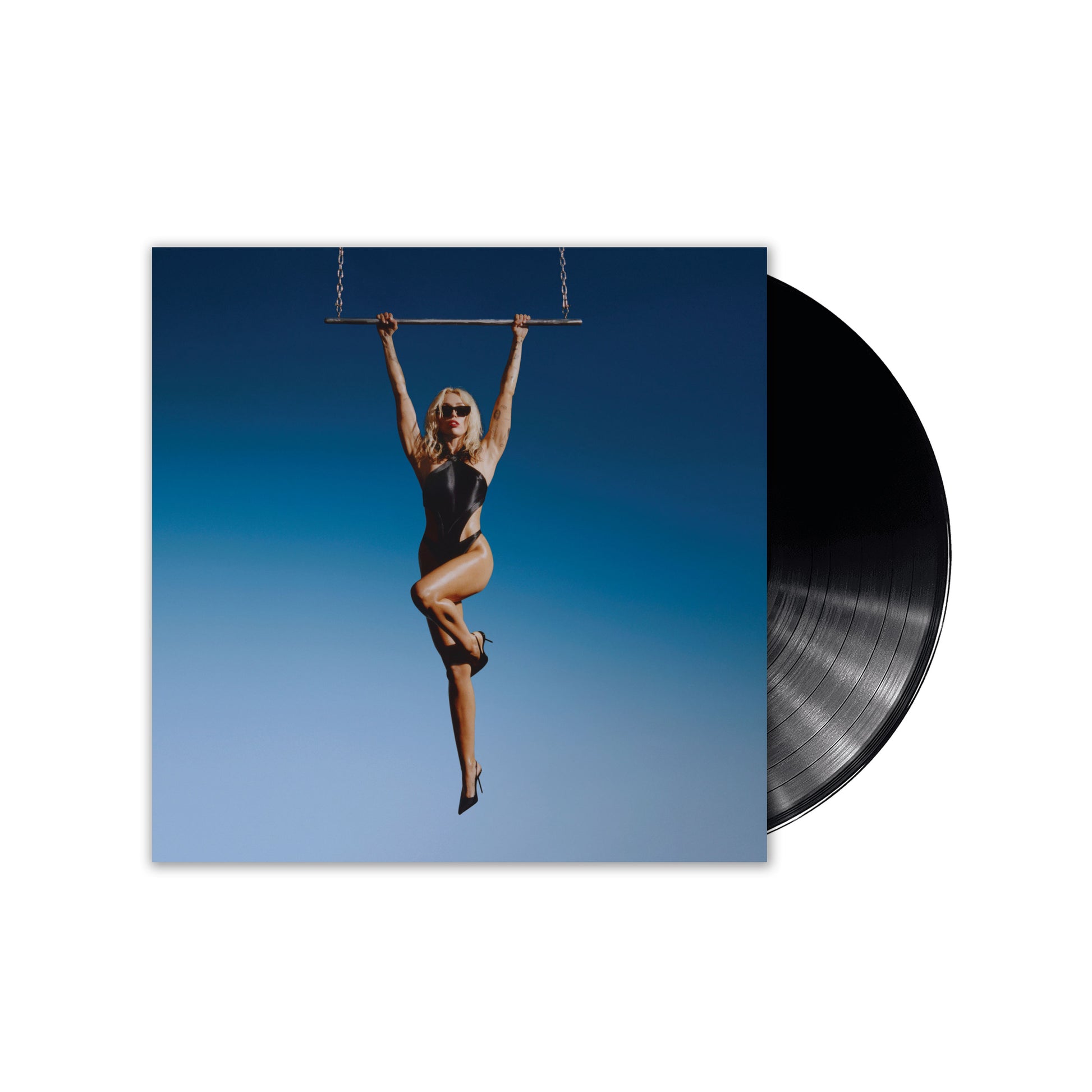 "Miley Cyrus vinyl record album cover with a woman swinging on a trapeze."