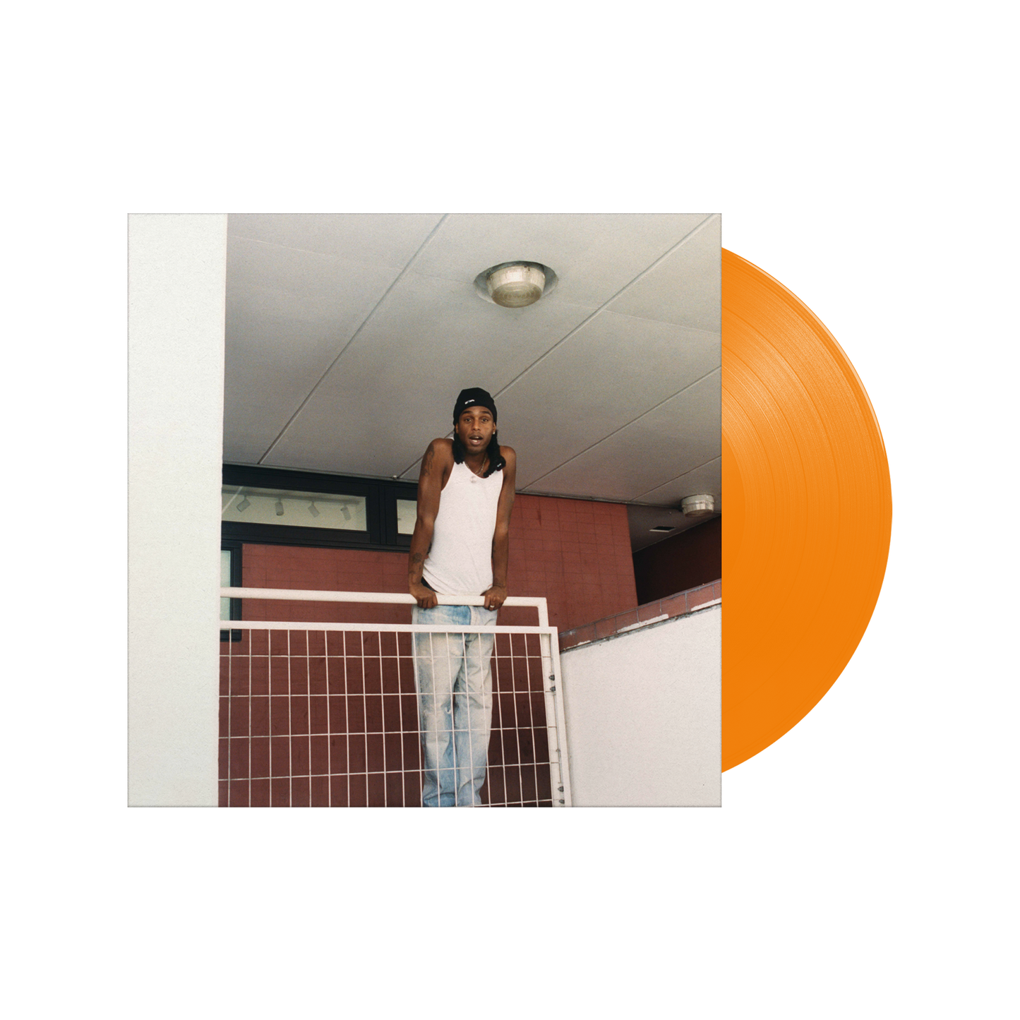 "Orange vinyl record with album cover featuring a man leaning on a railing."