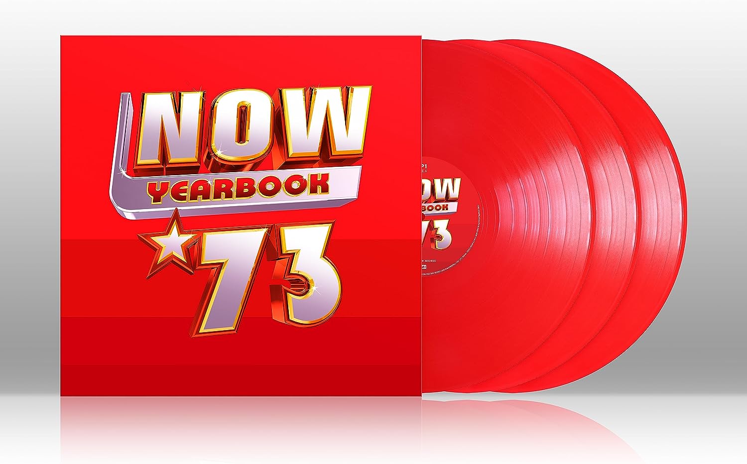 "Red vinyl record set with 'NOW YEARBOOK 73' cover."