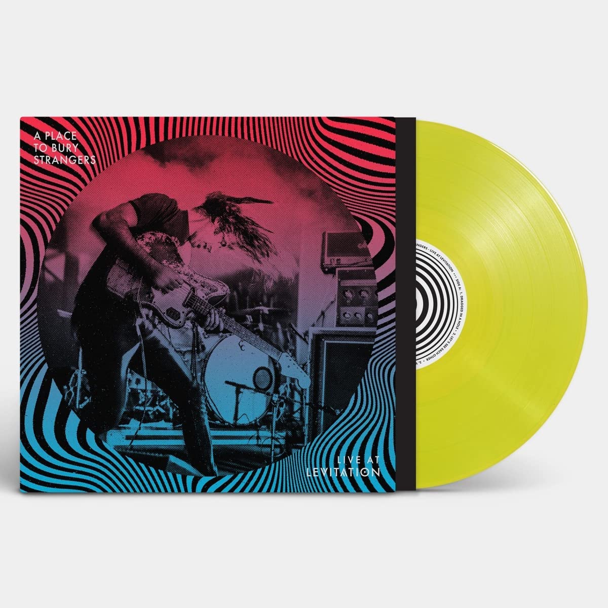 Yellow vinyl record with cover art featuring a musician playing guitar.