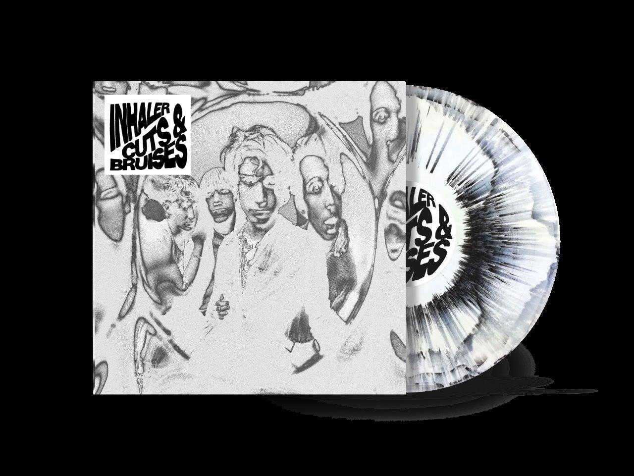 Vinyl record with white and black splatter, in a black and white album cover.