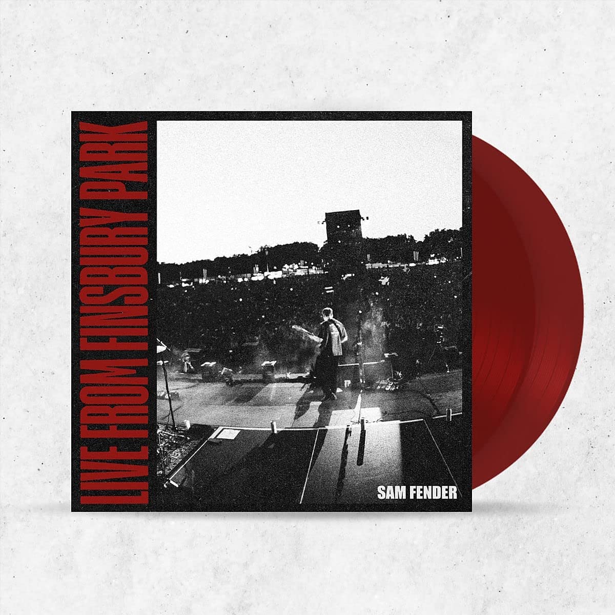 Red vinyl record with black and white album cover featuring Sam Fender on stage.