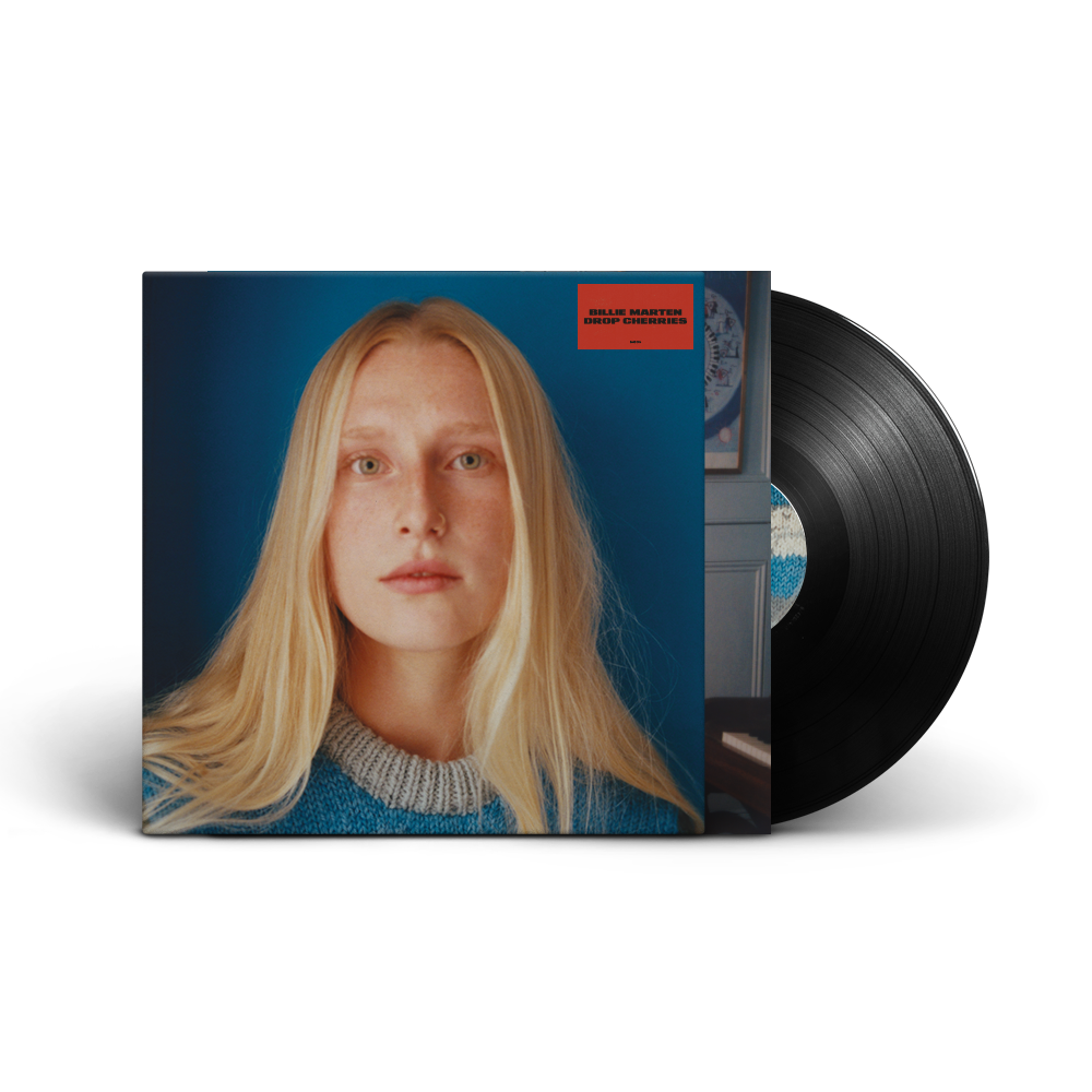 Vinyl record with cover featuring a blonde woman against a blue background.