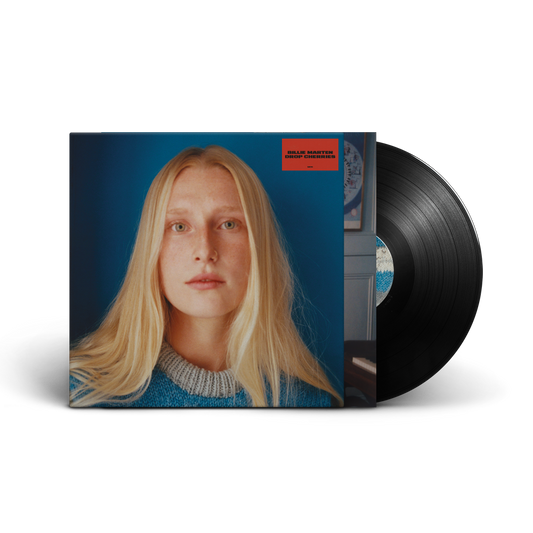 Vinyl record with cover featuring a blonde woman against a blue background.