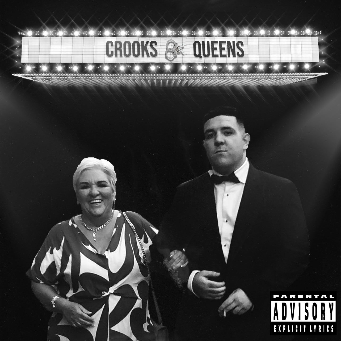 "Black and white album cover with man and woman under a marquee sign."