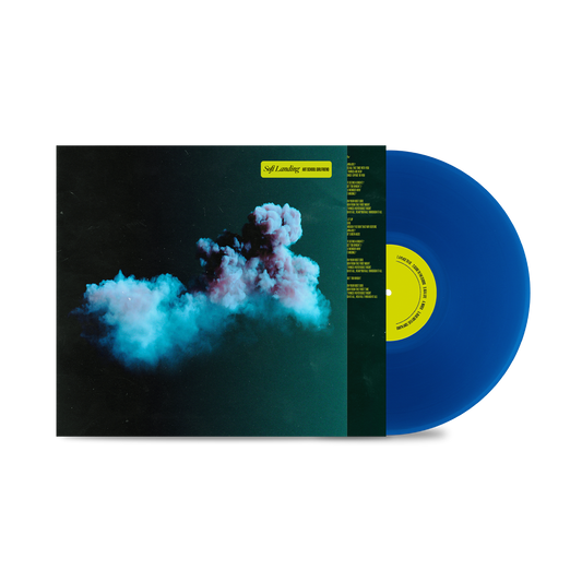 "Blue vinyl record with album cover featuring a cloud image against a dark background."