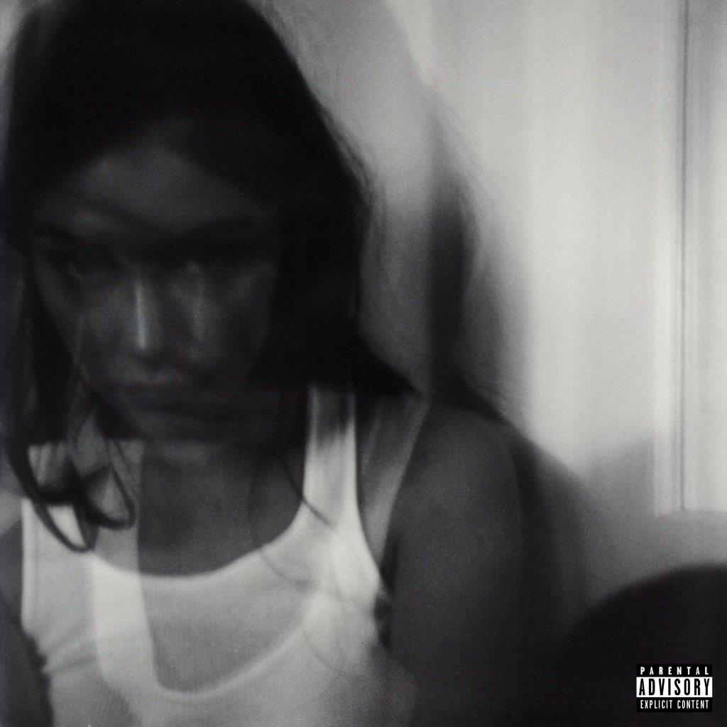 "Black and white album cover featuring a blurred woman in a white tank top."