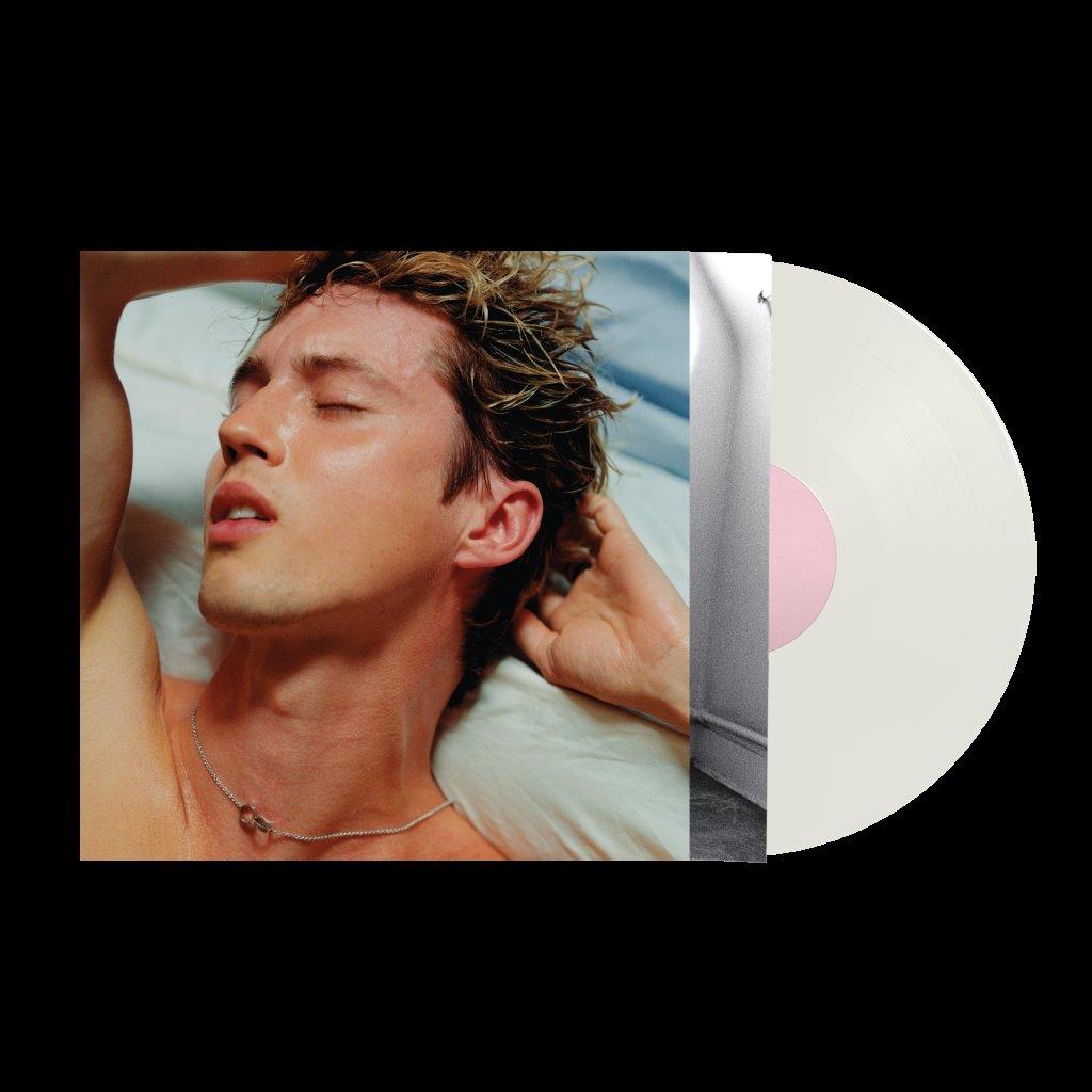 "Vinyl record sleeve with a man lying on a pillow and a white vinyl."