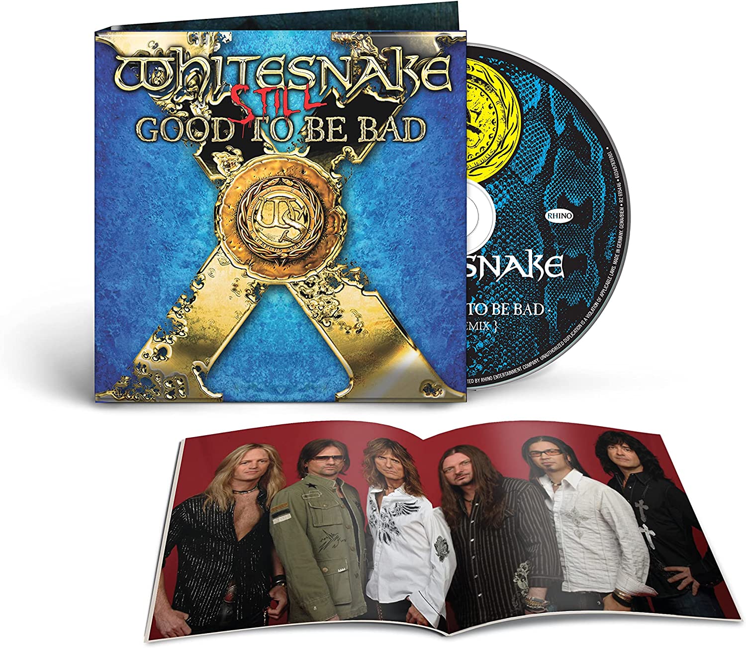 "CD case with blue cover, gold emblem, and open booklet showing band members."