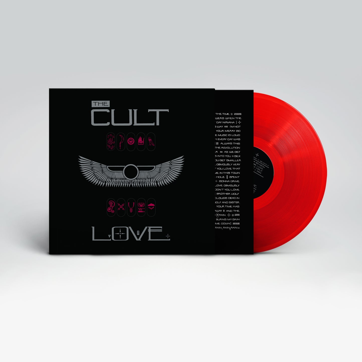 Red vinyl record and black album cover with grey and pink design.