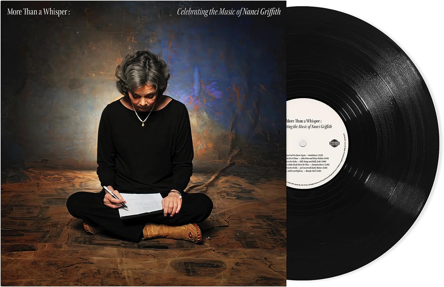 "Vinyl record with cover art featuring a woman writing on a notepad."