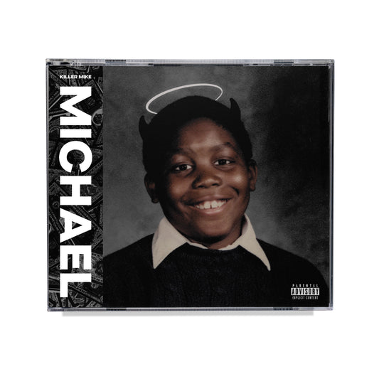 "CD case with a black-and-white portrait of a smiling boy with devil horns and halo."
