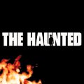 The image shows the text "THE HAUNTED" against a black background with flames.