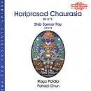 A CD cover featuring an oval, colorful design with blue text and a red logo.