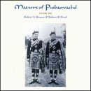 "CD cover featuring two men in traditional Scottish kilts holding bagpipes."