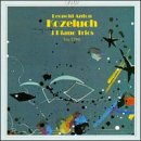 A CD cover with abstract shapes on a teal background and yellow text.
