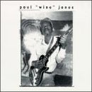 Black and white album cover featuring a man playing an electric guitar.