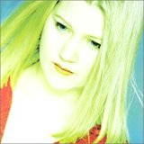 Album cover with a blonde woman's portrait, blue background, and artist's name on left.