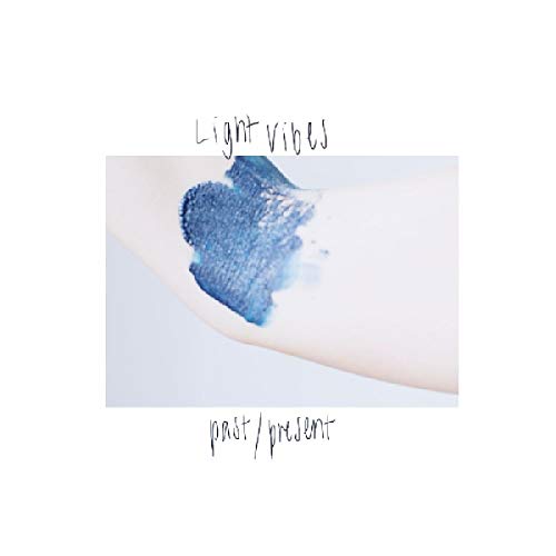 The alt text for the image is: "A vinyl record cover with a blue smudge on a white surface."