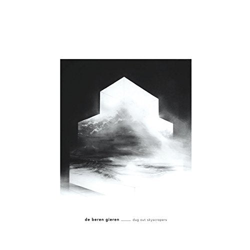 "Black and white vinyl album cover with a cloudy, abstract building design."