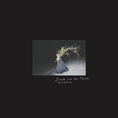 A CD cover featuring a kneeling woman with wisteria on her head, on a black background.