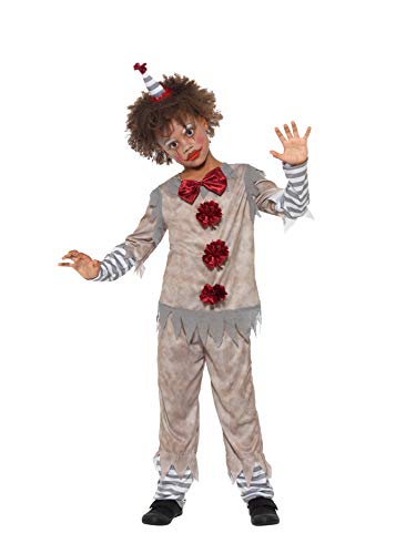 A child in a grey and red clown costume with frayed edges and striped cuffs.