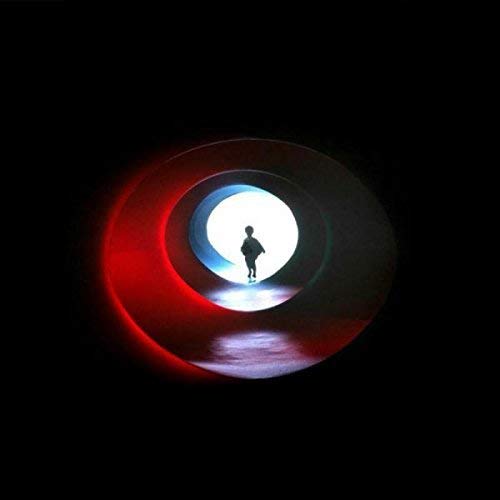 The vinyl record cover for "Yards - Excitation Thresholds" features a silhouette of a person in a circular tunnel.