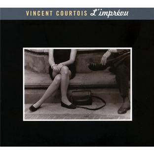 "CD cover with sepia-toned image of a man and woman on a bench."