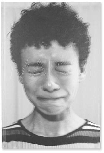 Black and white photograph of a person with closed eyes and "MARVEL" text overlay.