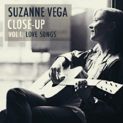 "Suzanne Vega album cover with a black and white photo of her playing guitar."
