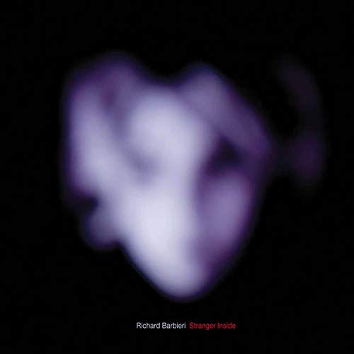 A vinyl record cover with a blurry, white, cloud-like shape on a black background.