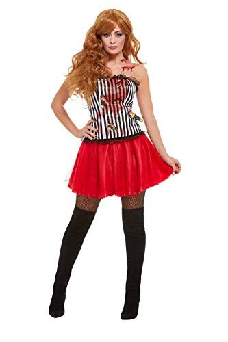 Woman in a striped and red costume, black stockings, posing against a white background.