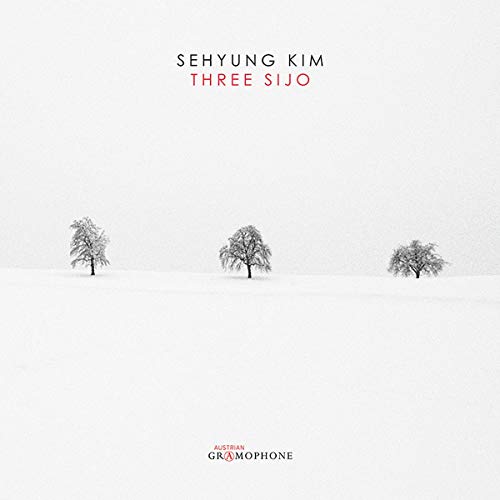 "Album cover featuring three snow-covered trees on a white background with text."
