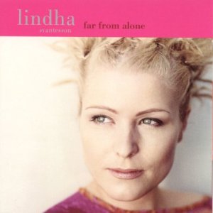 CD album cover featuring a blonde woman with a pink banner and text.