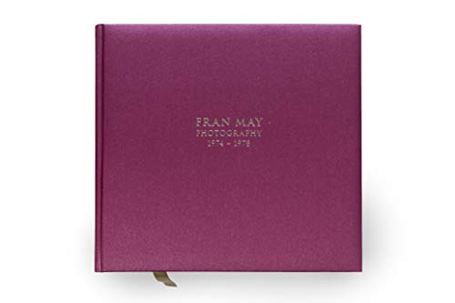 A pink book cover with gold text "Fran May Photography 1974-1978".