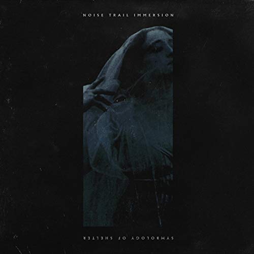 "Album cover with a hooded figure on a black background, text at top and bottom."