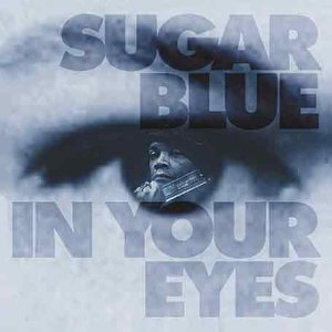 A monochrome album cover with a man's face reflected in an eye.