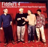 "CD cover featuring four men standing in front of a red curtain."