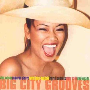 CD cover featuring a woman in a wide-brimmed hat, laughing, with multicolored text.