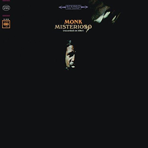 Thelonious Monk's "Misterioso" vinyl album cover with a black background and blurry face.