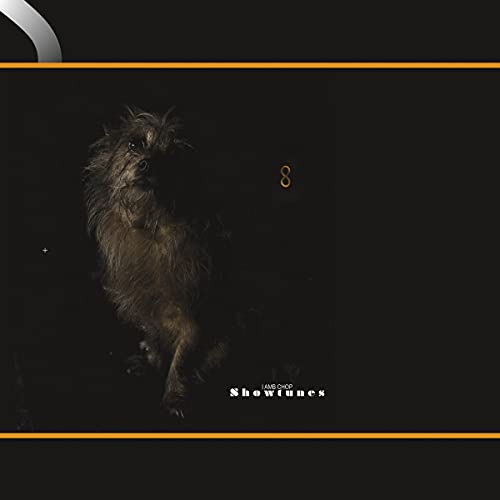 "Album cover with a dog on a black background, titled 'Lambchop - Showtunes'."