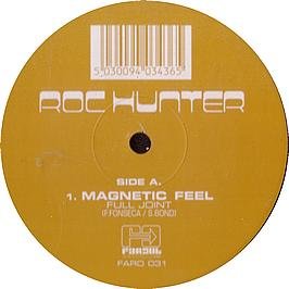 Vinyl record with yellow label, barcode, and white text reading "Roc Hunter" and "Magnetic Feel".