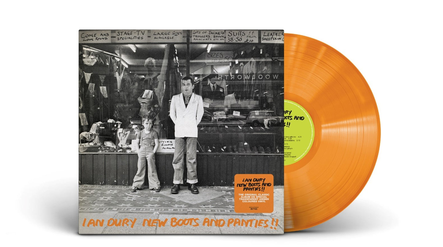 "Orange vinyl record with album cover featuring black-and-white clothing store photo."