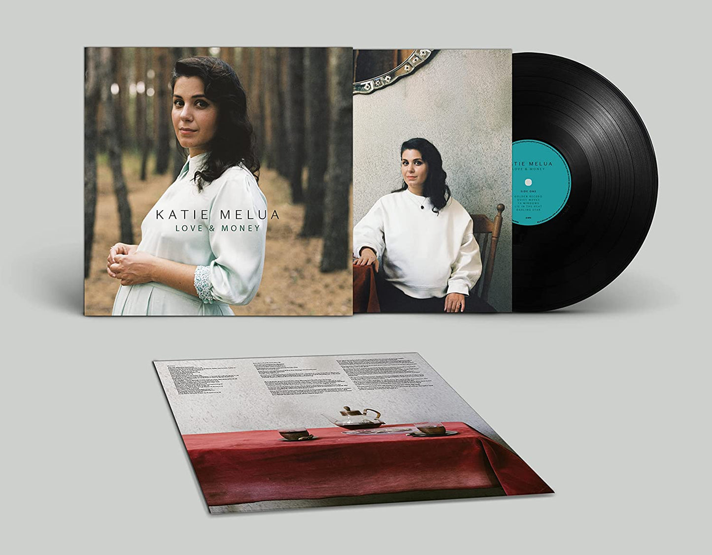 "Vinyl record and cover with Katie Melua's image and 'Love & Money' title."