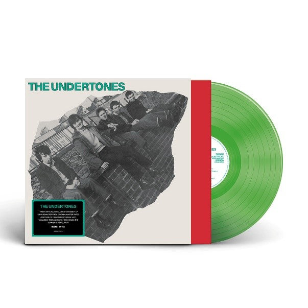"Green vinyl record with white sleeve featuring a black and white band photo."