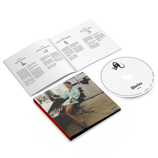 "CD case with booklet and disc, featuring Rita Ora on the cover."