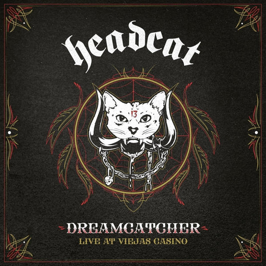 "Album cover with a white cat's head surrounded by feathers and a spider web."
