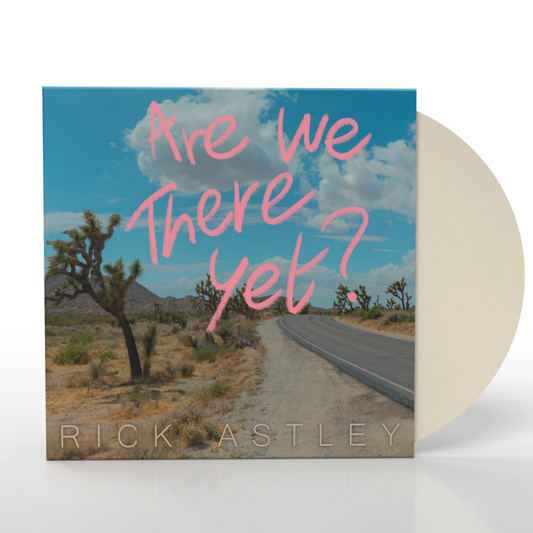 "Vinyl record sleeve with desert road cover art and beige vinyl partially visible."